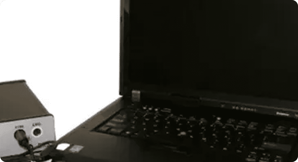 Open laptop beside connected device