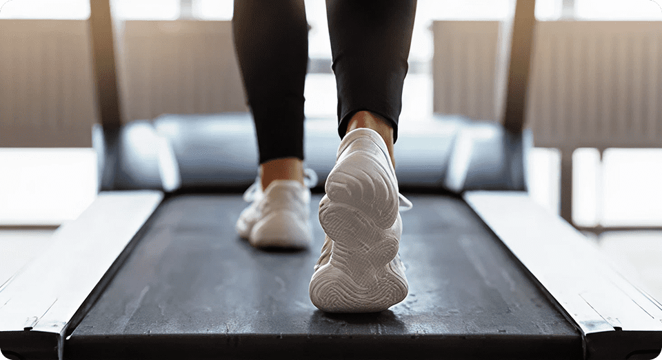 Close-up of feet on treadmill